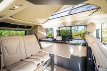 Image of the Mercedes Marco Polo interior, looking at the dining area from the open rear side door