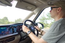 Image of a driver at the wheel of a Volkswagen California campervan