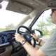 Image of a driver at the wheel of a Volkswagen California campervan