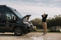Image of a man with a broken down campervan