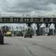 Image of cars going through a gare de peage in France