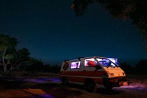 Image of a Mitsubishi Delica campervan under a night sky in Australia
