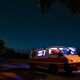 Image of a Mitsubishi Delica campervan under a night sky in Australia