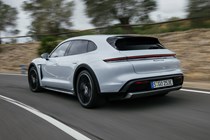 Porsche Taycan Cross Turismo review: rear three quarter driving, grey paint