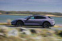 Porsche Taycan Cross Turismo review: side view driving, purple paint