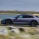 Porsche Taycan Cross Turismo review: side view driving, purple paint