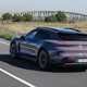 Porsche Taycan Cross Turismo review: rear three quarter driving, purple paint