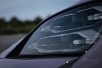 Porsche Taycan Cross Turismo review: LED headlight, close-up angle, purple paint