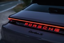 Porsche Taycan Cross Turismo review: rear light bar and illuminated Porsche badge, purple paint
