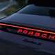 Porsche Taycan Cross Turismo review: rear light bar and illuminated Porsche badge, purple paint