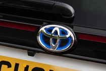 Blue highlights on Toyota badge indicate hybrid