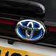 Blue highlights on Toyota badge indicate hybrid