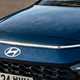 Hyundai Bayon (2025) review: front badge and light bar, blue paint