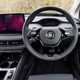 Skoda Enyaq Coupe (2024) review: steering whee, black leather upholstery