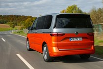 Volkswagen Multivan review, rear view, driving, silver and orange, L1, Energetic eHybrid