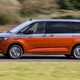 Volkswagen Multivan review, side view, driving, silver and orange, L1, Energetic eHybrid
