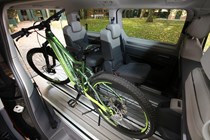 Volkswagen Multivan review, rear seat area carrying mountain bike