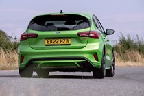 Ford Focus ST review, facelift, Mean Green, rear view, driving round corner