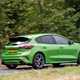 Ford Focus ST review, facelift, Mean Green, rear view, driving