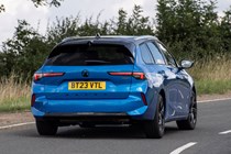Vauxhall Astra Sports Tourer estate review - rear, driving round corner, blue