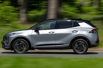 Kia Sportage review, silver, moving, side (2025)