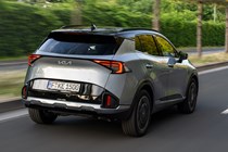 Kia Sportage review, silver, moving, rear (2025)