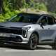 Kia Sportage review, silver, moving, front three quarters (2025)