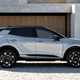 Kia Sportage review, silver, static, side (2025)