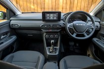 Dacia Jogger (2023) review: dashboard and infotainment system from rear seats, black upholstery
