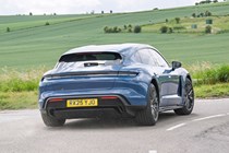 Porsche Taycan Sport Turismo (2025) review: rear three quarter cornering, blue paint