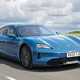Porsche Taycan Sport Turismo (2025) review: front three quarter driving, blue paint