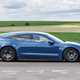 Porsche Taycan Sport Turismo (2025) review: side view driving, blue paint