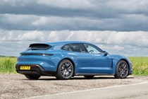 Porsche Taycan Sport Turismo (2025) review: rear three quarter static, blue paint