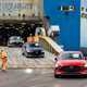 Image of several Mazda cars being driven off a transport ship