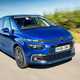 Image of a blue Citroen C4 Picasso, viewed from the front right corner while driving