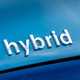 Close up image of the 'Hybrid' badge on a Toyota Prius