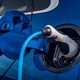Close-up image of an EV charging cable plugged into a car