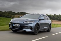 BYD Seal 6 DM-i Touring (2025) review: front three quarter tracking, grey paint, low angle