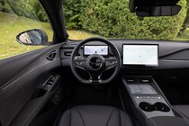 BYD Seal 6 DM-i Touring (2025) review: steering wheel and infotainment system, black upholstery