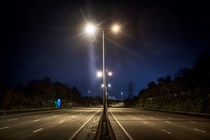 Image of an empty motorway at night, taken from above the central reservation