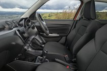 Suzuki Swift (2023) review: front seats, black cloth upholstery