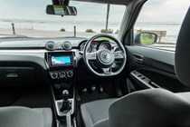 Suzuki Swift (2023) review: front seats and dashboard