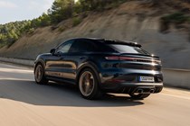 Porsche Cayenne Coupe review - 2023 facelift - Turbo E-Hybrid with GT Package, rear, blue and gold, driving on racing circuit