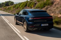 Porsche Cayenne Coupe review - 2023 facelift - Turbo E-Hybrid with GT Package, rear, blue and gold, driving on road