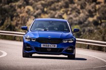 BMW 3 Series review - dead-on front view, blue, driving round corner