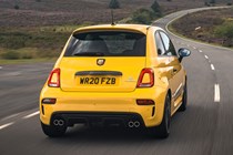 Abarth 595 (2022) review: rear three quarter driving shot, yellow car