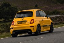 Abarth 595 (2022) review: rear cornering shot, yellow car