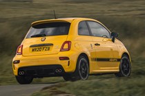 Abarth 595 (2022) review: rear three quarter cornering shot, yellow car