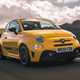 Abarth 595 (2022) review: front three quarter driving shot, yellow car