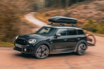 MINI Countryman (2023) review: front three quarter cornering, off-road driving, black paint